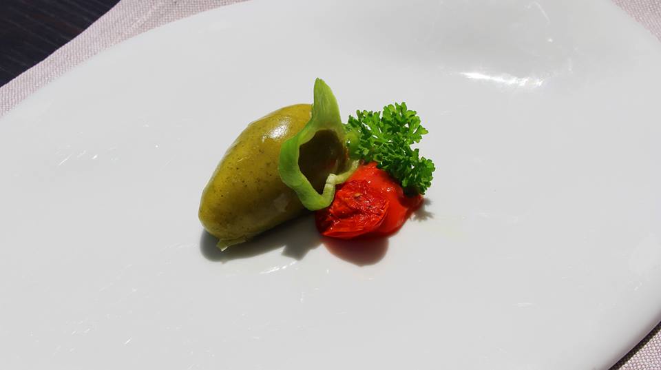 Quenelle of whipped salt cod, with cottage cheese, glazed with green pepper, lemon and tomato Piennolo