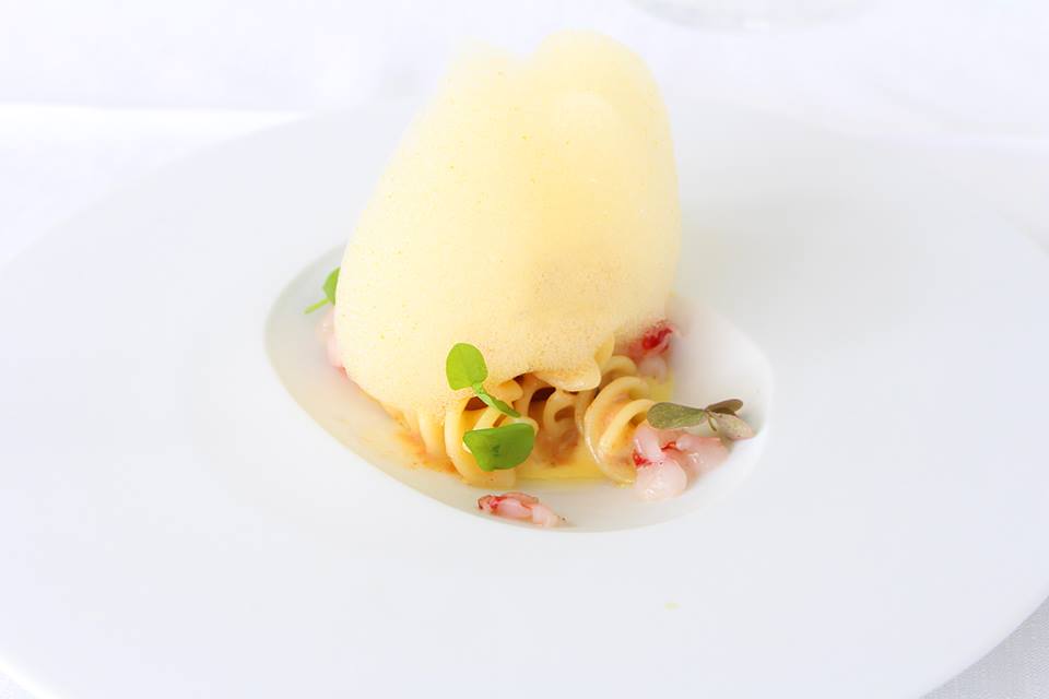 Fusilli with Sea urchins, raw prawns with salted pastry cream and orange mousse  Quattro Passi Restaurant